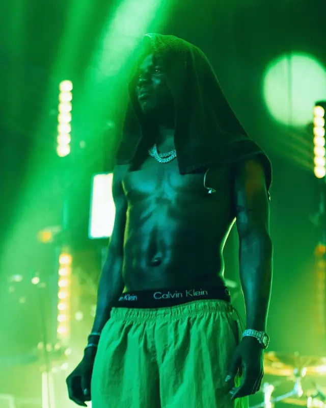 Rema outfit in Converse, New Era, and Calvin Klein, 2022
