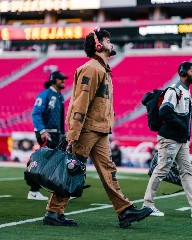 Caleb Williams outfit in Travis Scott Merch, Louis Vuitton, and PlayStation, 2022