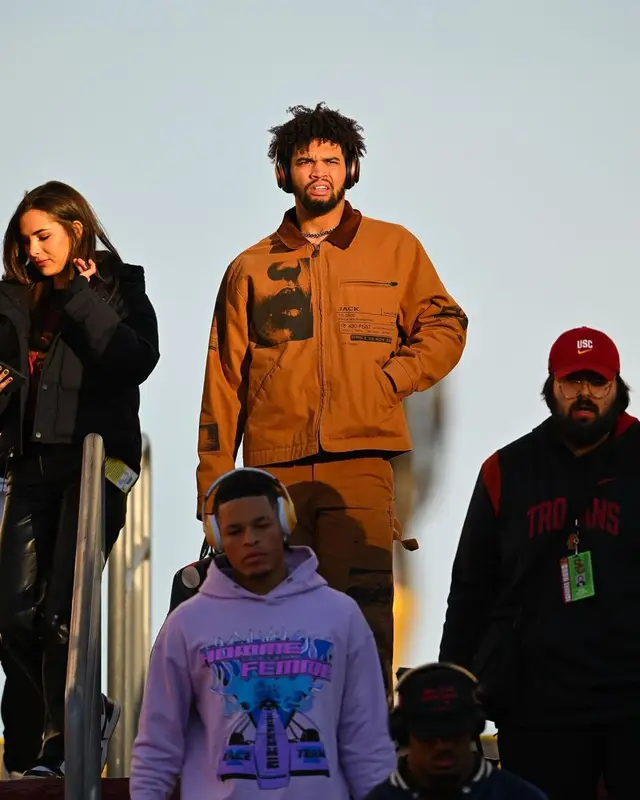 Caleb Williams outfit in Travis Scott Merch, Louis Vuitton, and PlayStation, 2022