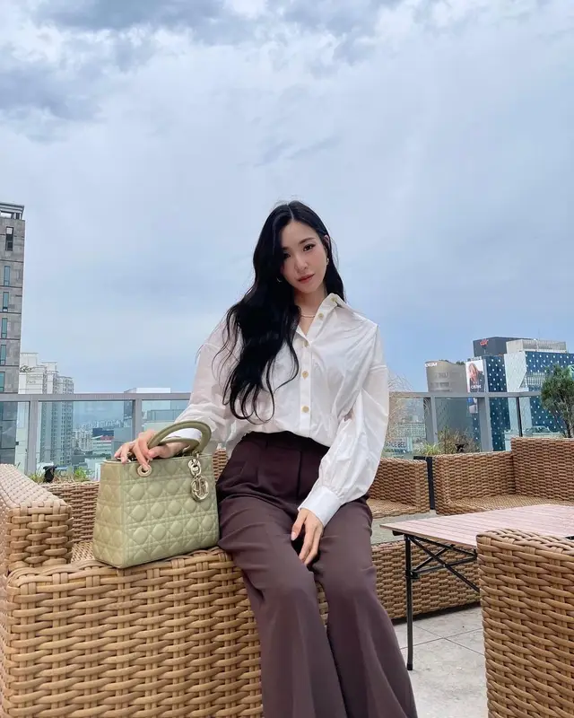 Tiffany Young outfit in Khaite, Nike, and Dior, 2022
