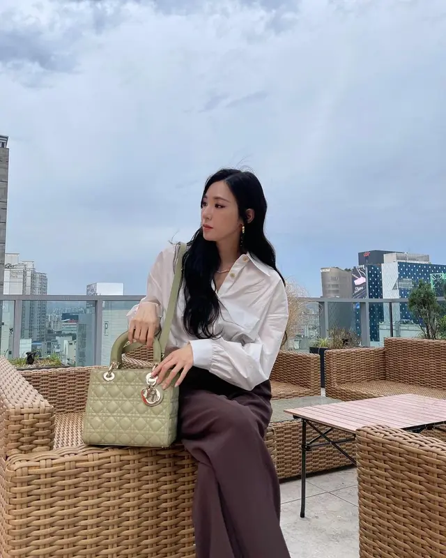 Tiffany Young outfit in Khaite, Nike, and Dior, 2022