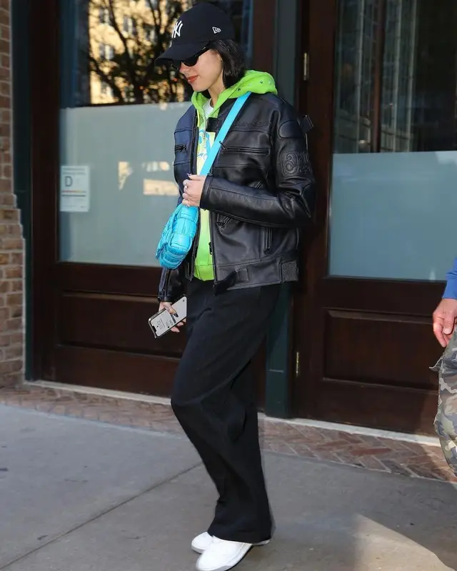 Dua Lipa outfit in Palace, Bottega Veneta, and New Era, 2022