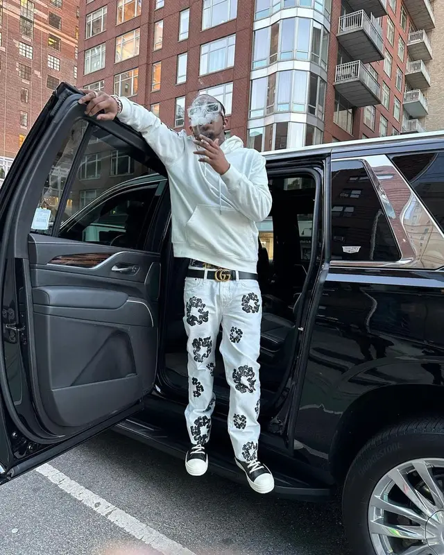 Loe Shimmy outfit in Purple Brand, Denim Tears, and Gucci, 2022