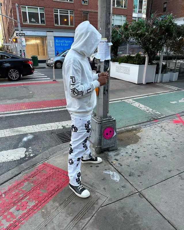 Loe Shimmy outfit in Purple Brand, Denim Tears, and Gucci, 2022