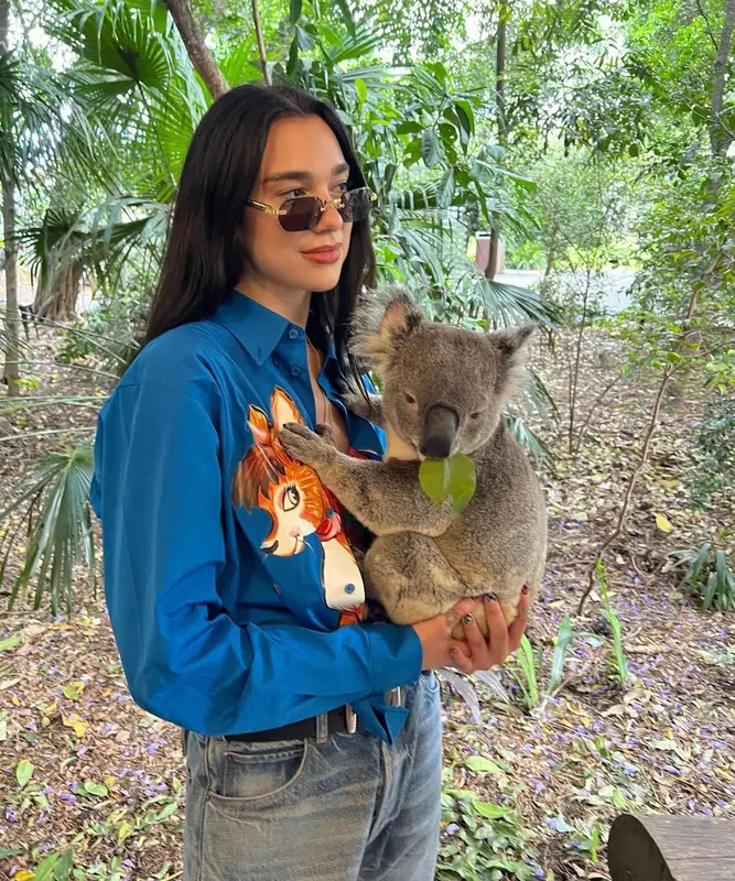 Dua Lipa outfit in Moschino, Chanel, and Cartier, 2022