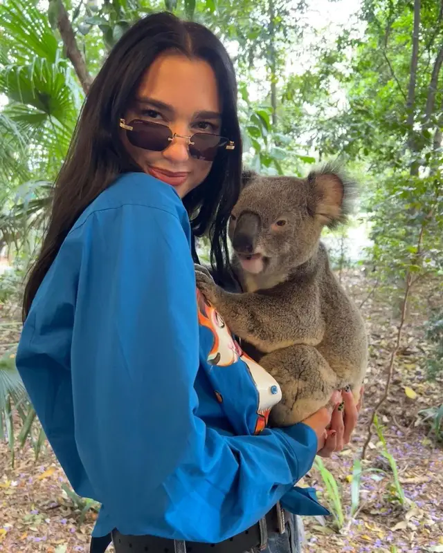 Dua Lipa outfit in Moschino, Chanel, and Cartier, 2022