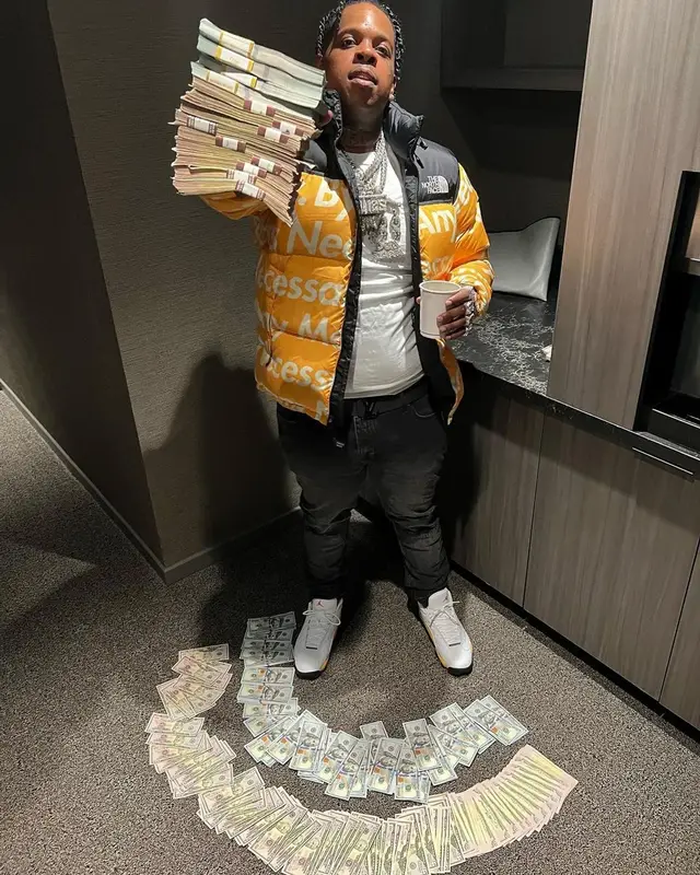 Finesse2tymes outfit in Supreme, Louis Vuitton, and The North Face, 2022