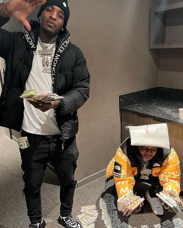 Finesse2tymes outfit in Supreme, Louis Vuitton, and The North Face, 2022
