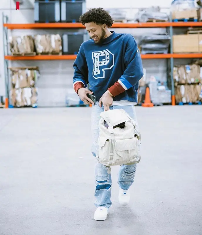 Cade Cunningham outfit in Moncler, Dior, and Palm Angels, 2022