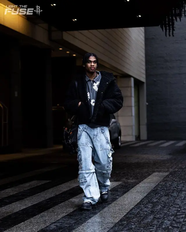 Joshua Christopher outfit in Denim Tears, Takashi Murakami, and Porter, 2022