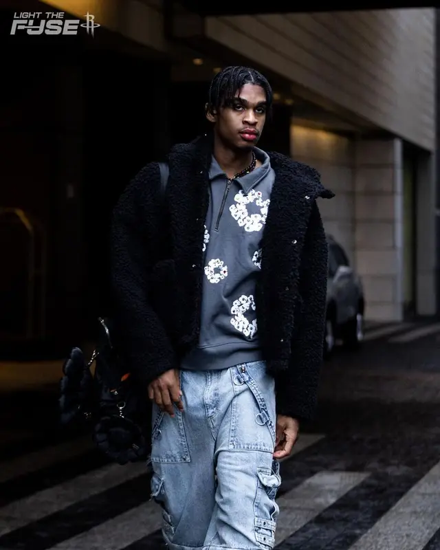 Joshua Christopher outfit in Denim Tears, Takashi Murakami, and Porter, 2022