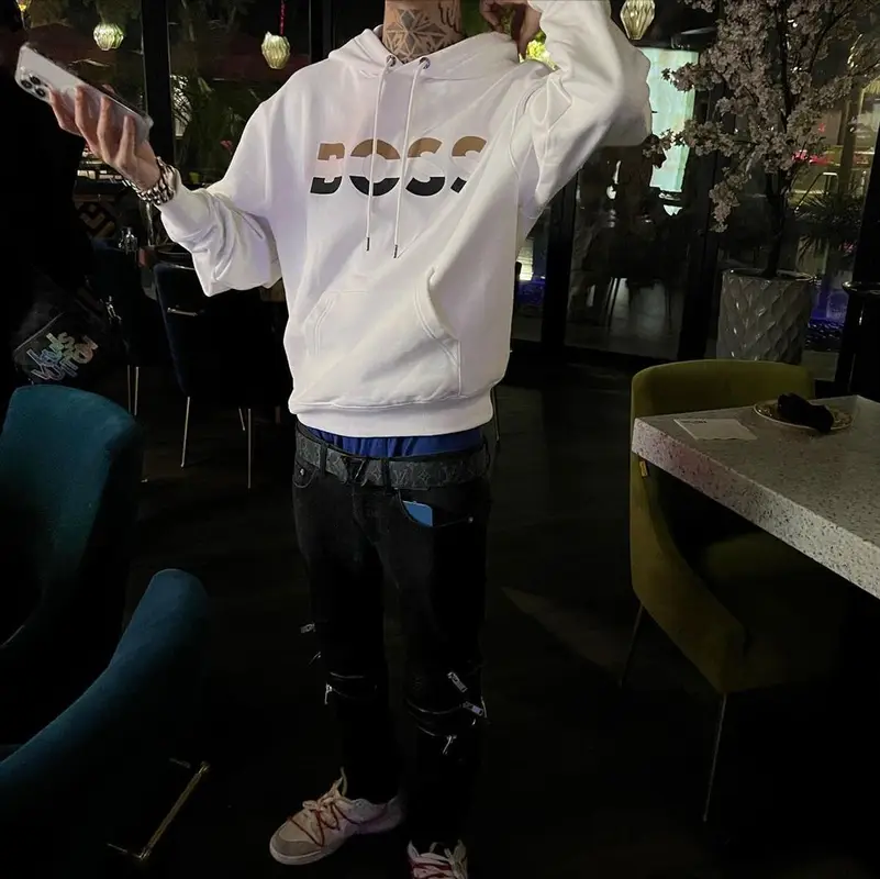 Natanael Cano outfit in Hugo Boss, Nike, and Louis Vuitton, 2022