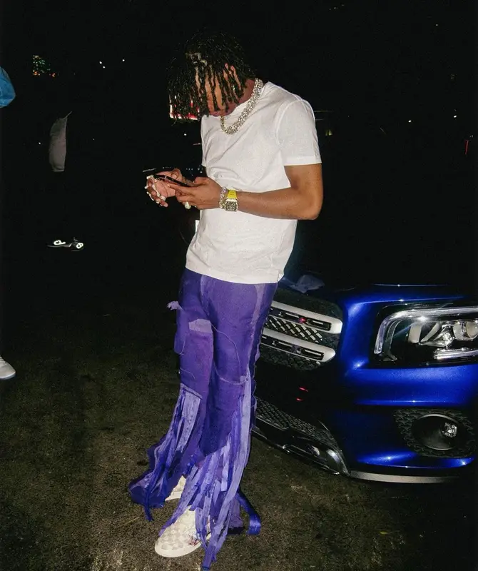 Lil Baby outfit in Louis Vuitton, Mokoo, and Nike, 2022