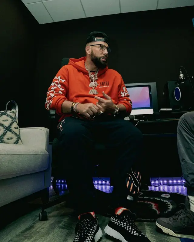 DJ Drama outfit in Thom Browne, Hermes, and Amiri, 2022