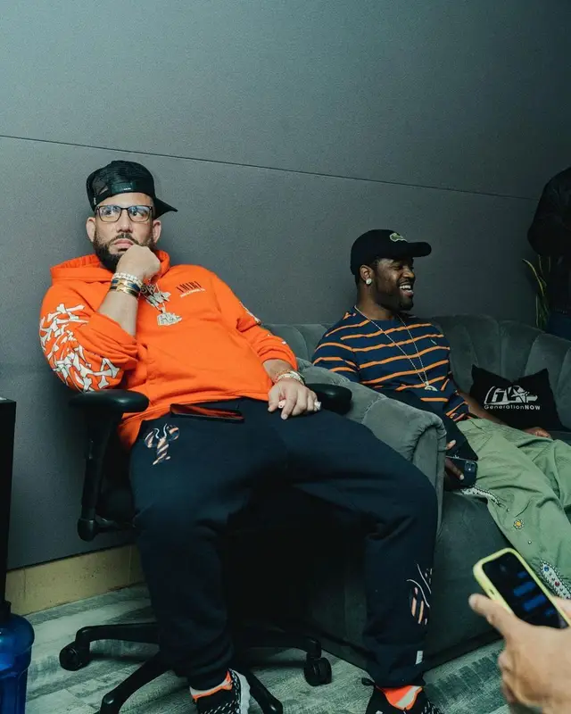 DJ Drama outfit in Thom Browne, Hermes, and Amiri, 2022