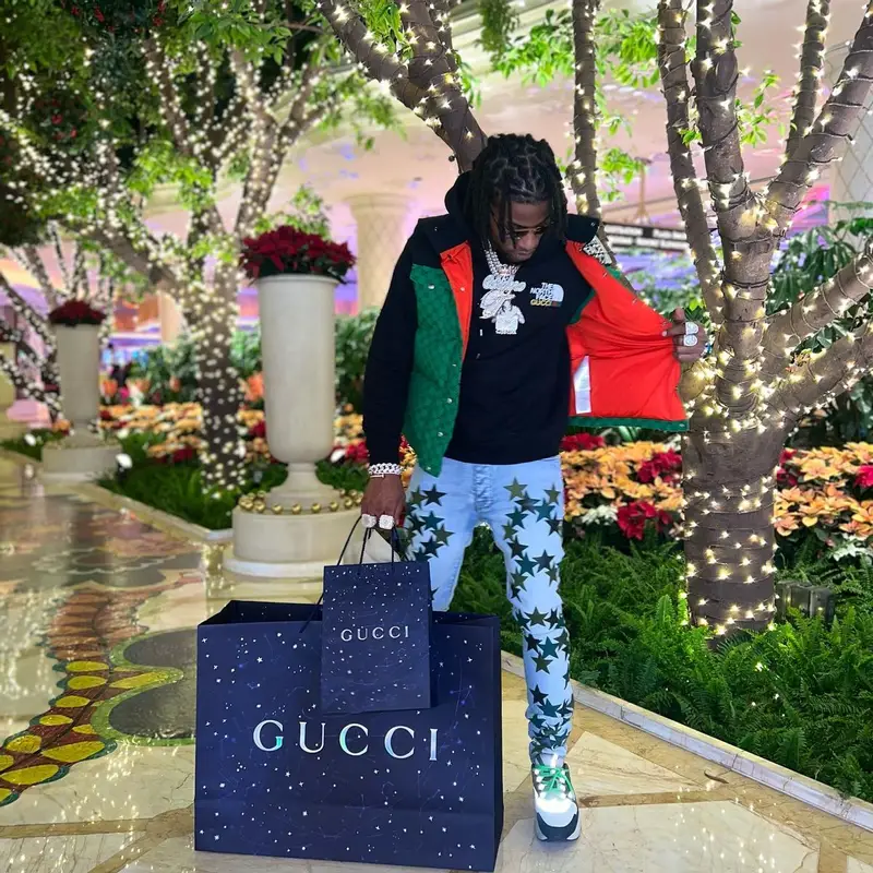 CJ So Cool outfit in Gucci, Louis Vuitton, and The North Face, 2022