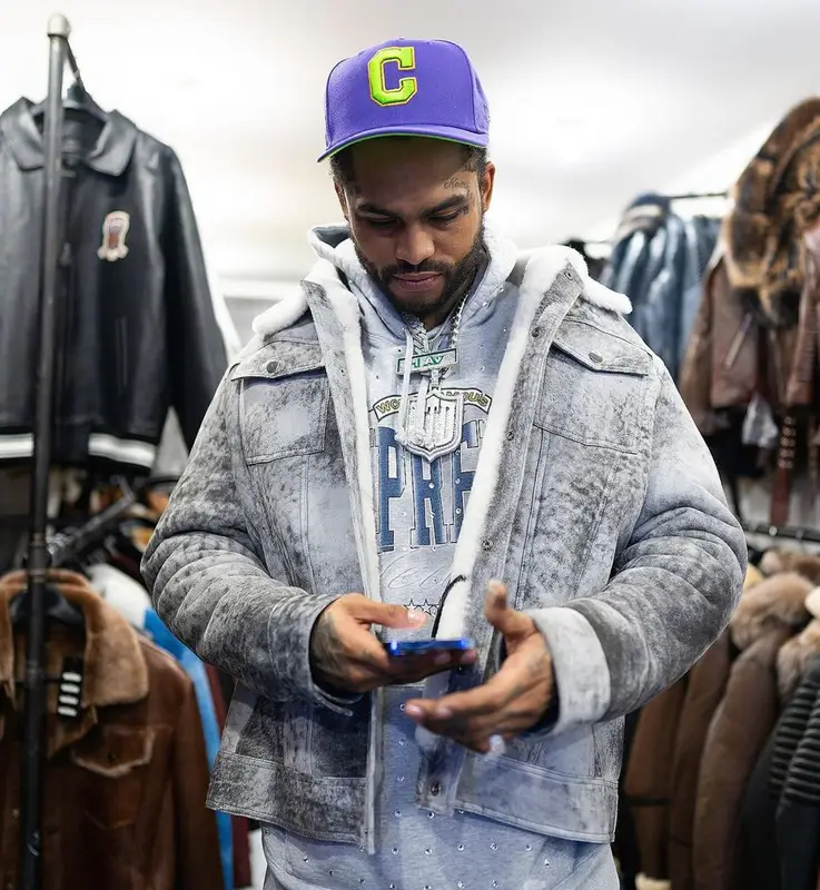 Dave East outfit in Supreme, Who Decides War, and New Era, 2022