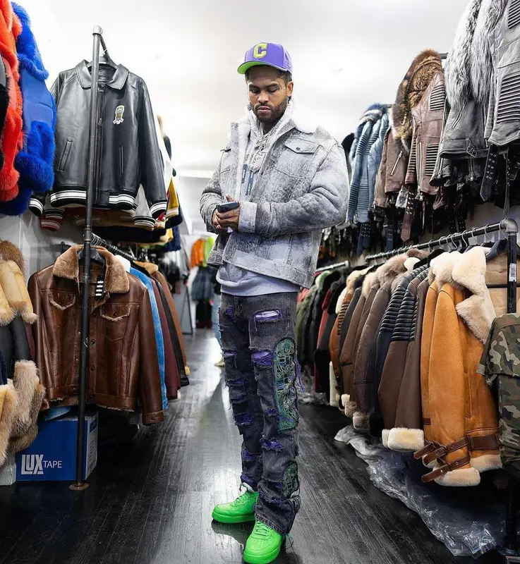 Dave East outfit in Supreme, Who Decides War, and New Era, 2022
