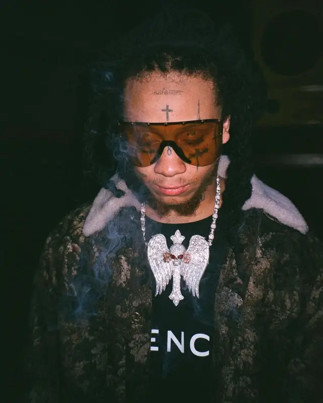 Trippie Redd outfit in Louis Vuitton, Givenchy, and Gucci, 2022