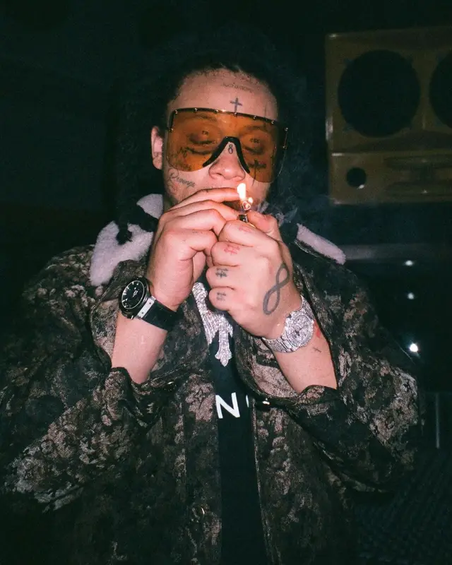 Trippie Redd outfit in Louis Vuitton, Givenchy, and Gucci, 2022