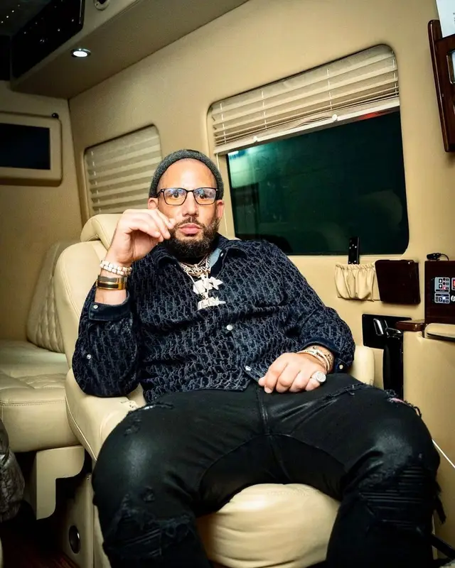 DJ Drama outfit in Dior, Amiri, and Balmain, 2022