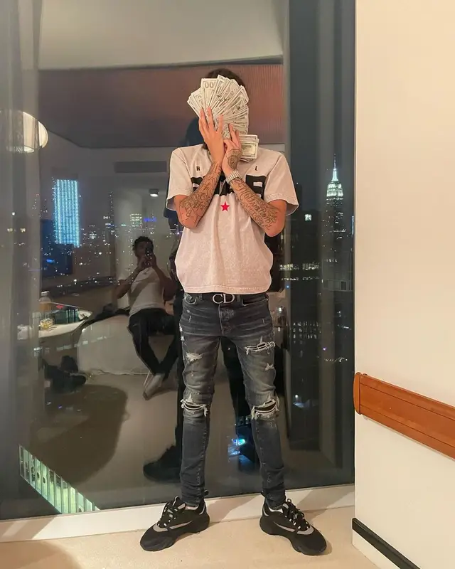 Ot7Quanny outfit in Hellstar, Amiri, and Dior, 2022