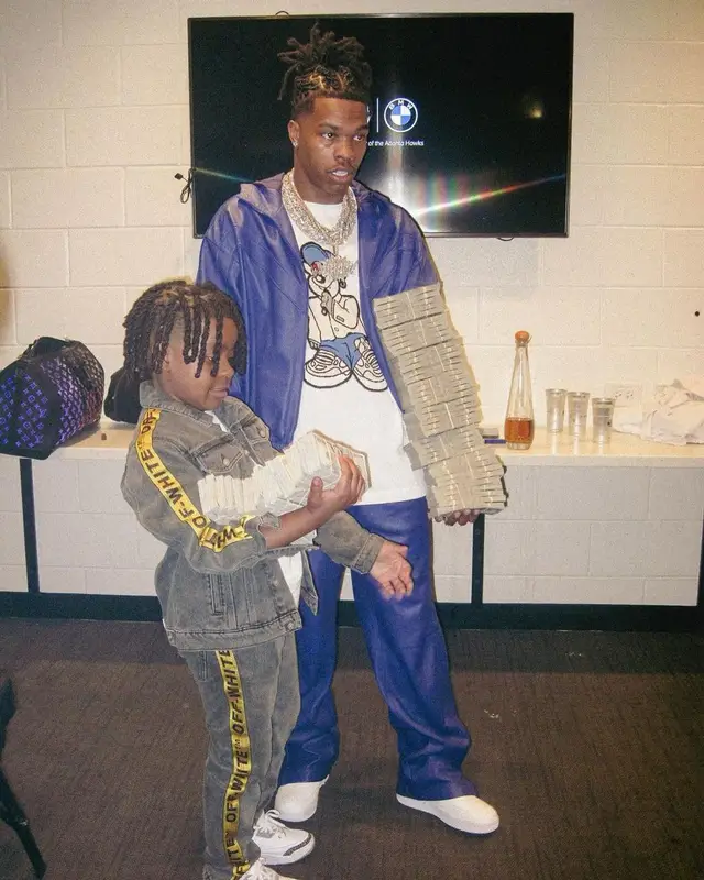 Lil Baby outfit in Louis Vuitton and Nike, 2022