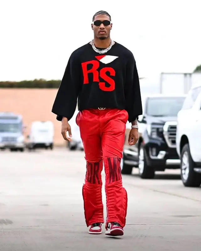 Isaiah Simmons outfit in Raf Simons, Who Decides War, and Nike, 2022