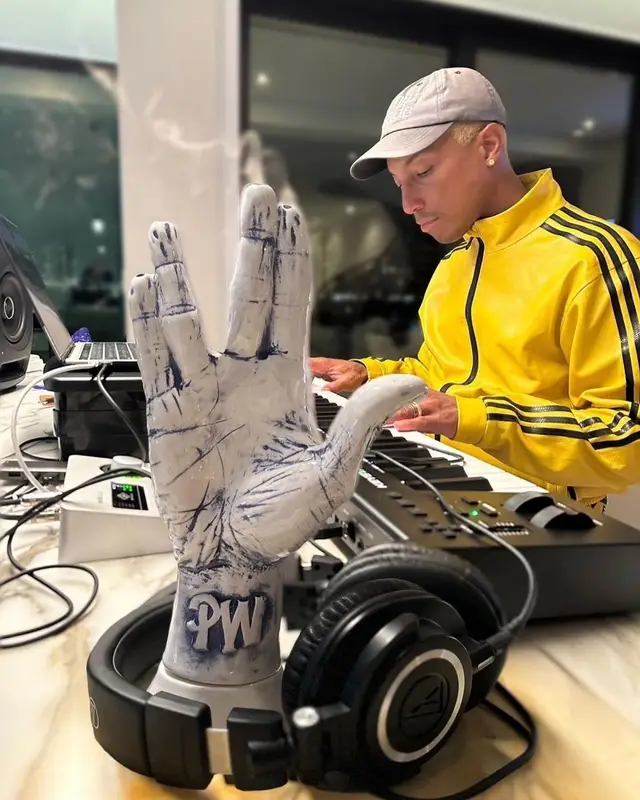Pharrell Williams outfit in Adidas, Human Made, and Girls Don't Cry, 2022