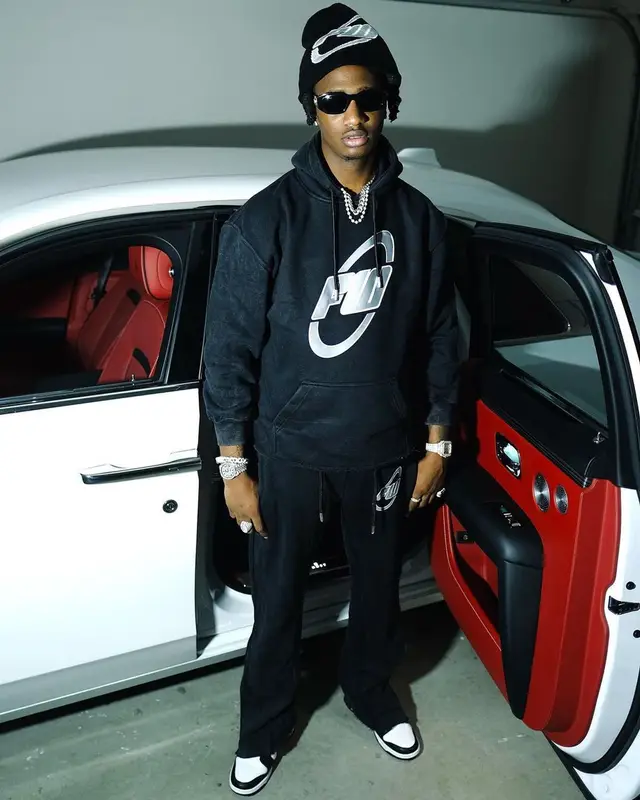 Yung Mal outfit in Nike, Versace, and Filthy Wealth, 2022