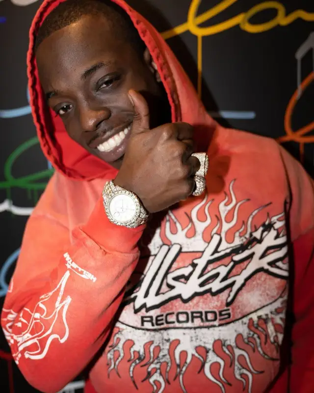 Bobby Shmurda outfit in Hellstar, Timberland, and Prada, 2022