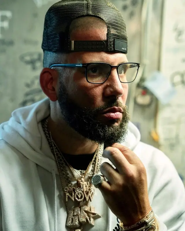 DJ Drama outfit in Off-White, Gallery Dept., and Amiri, 2022
