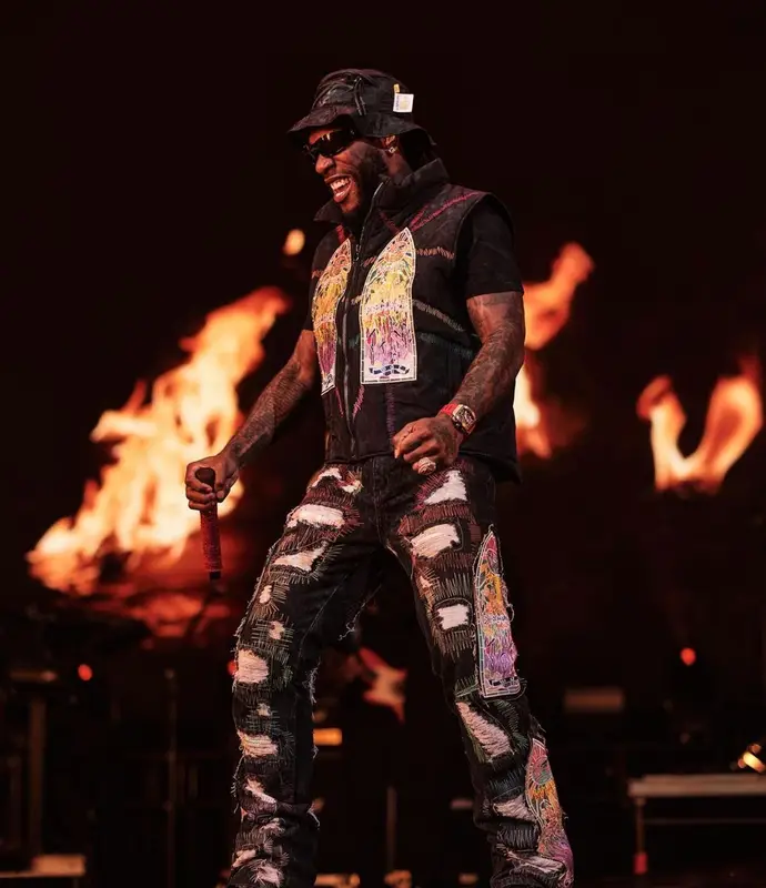 Burna Boy outfit in Who Decides War, Lanvin, and Gallery Dept., 2022