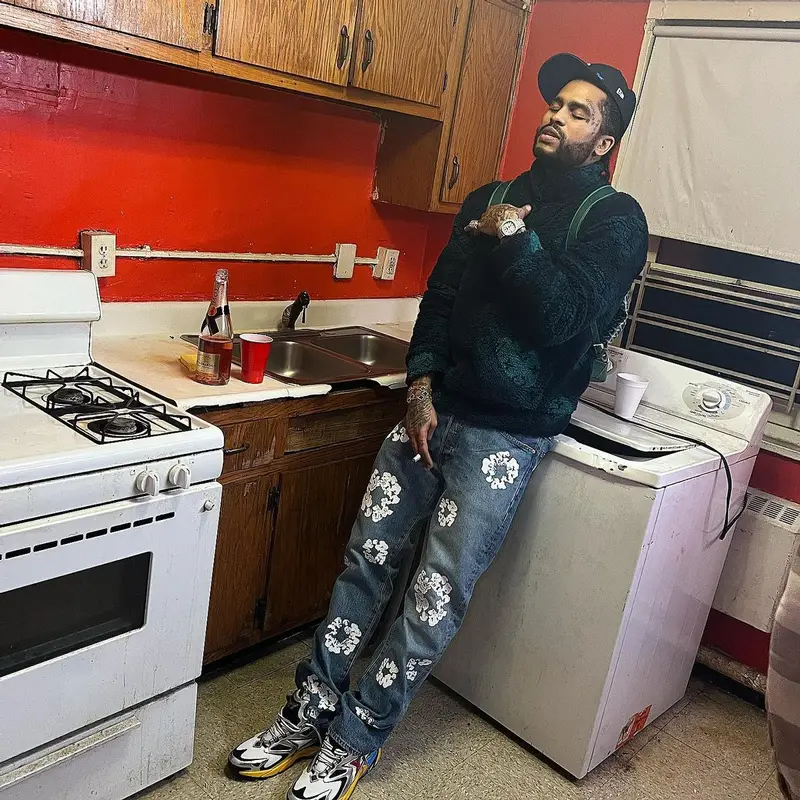 Dave East outfit in Louis Vuitton, New Era, and Just Don, 2022