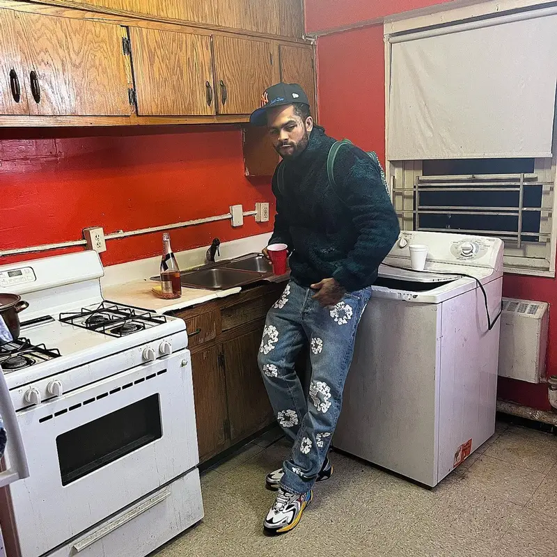 Dave East outfit in Louis Vuitton, New Era, and Just Don, 2022