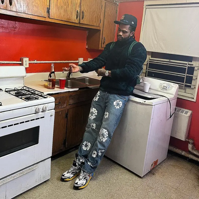 Dave East outfit in Louis Vuitton, New Era, and Just Don, 2022