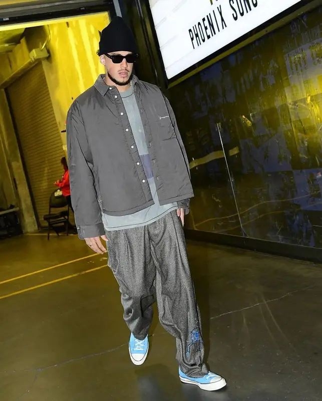 Devin Booker outfit in Jacquemus, Jean-Michel Basquiat, and Converse, 2022