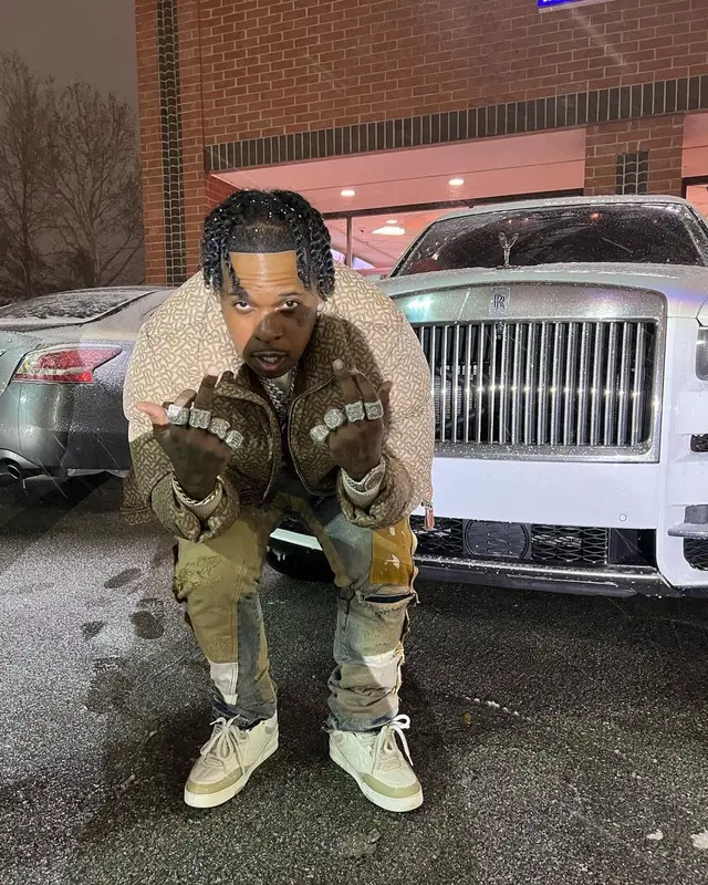 Finesse2tymes outfit in Burberry, Louis Vuitton, and Gucci, 2022