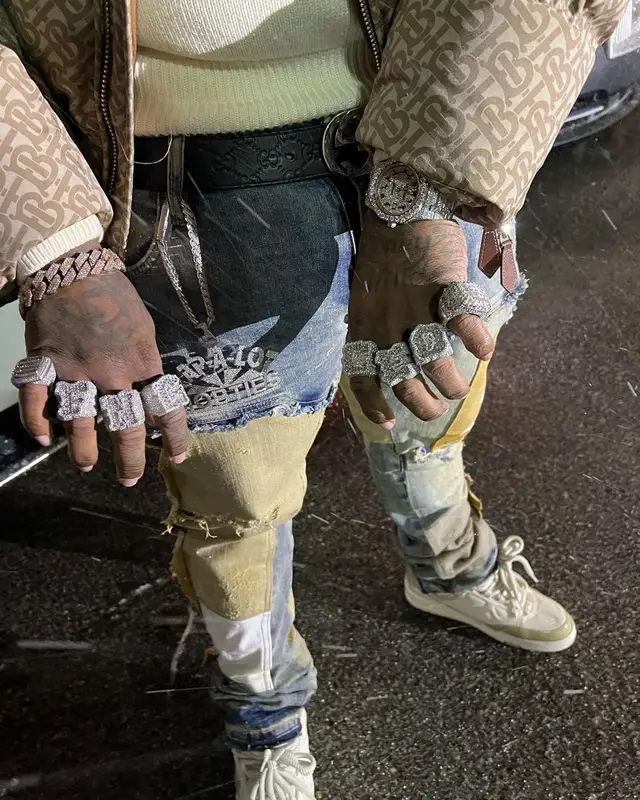 Finesse2tymes outfit in Burberry, Louis Vuitton, and Gucci, 2022