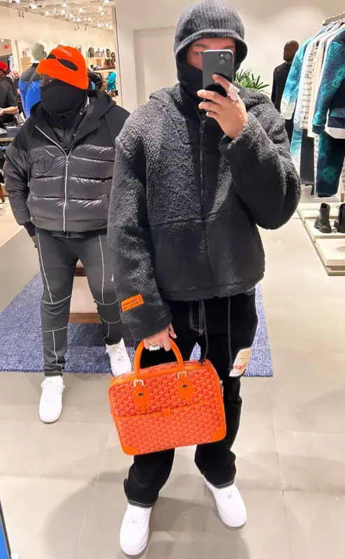 Lil Baby outfit in Heron Preston, Nike, and Goyard, 2022