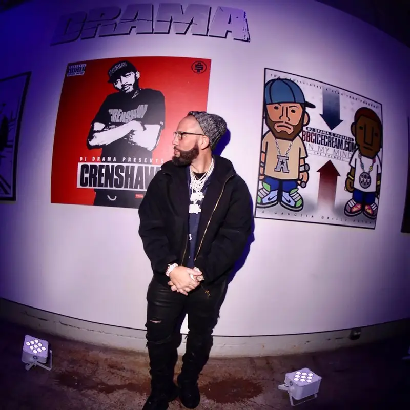 DJ Drama outfit in Louis Vuitton, Amiri, and Tom Ford, 2022