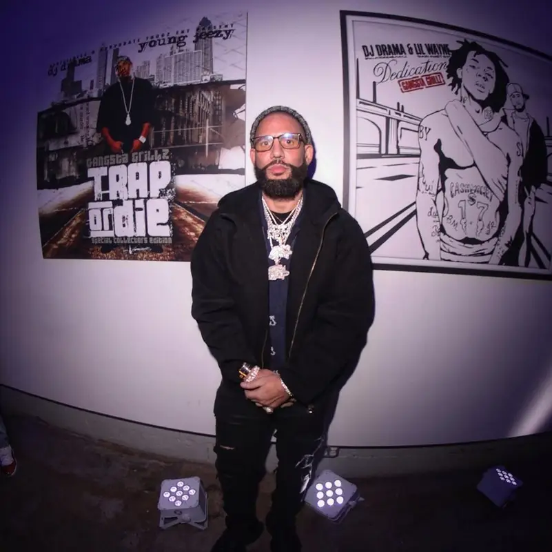 DJ Drama outfit in Louis Vuitton, Amiri, and Tom Ford, 2022