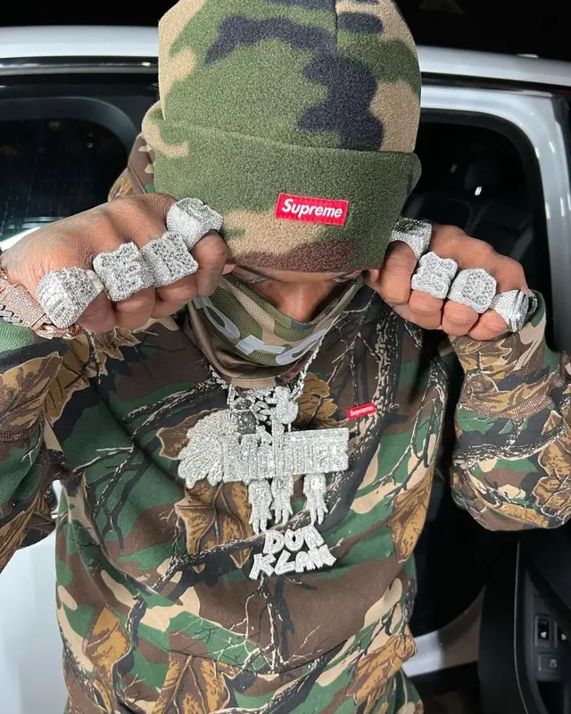 Finesse2tymes outfit in Jordan and Supreme, 2022