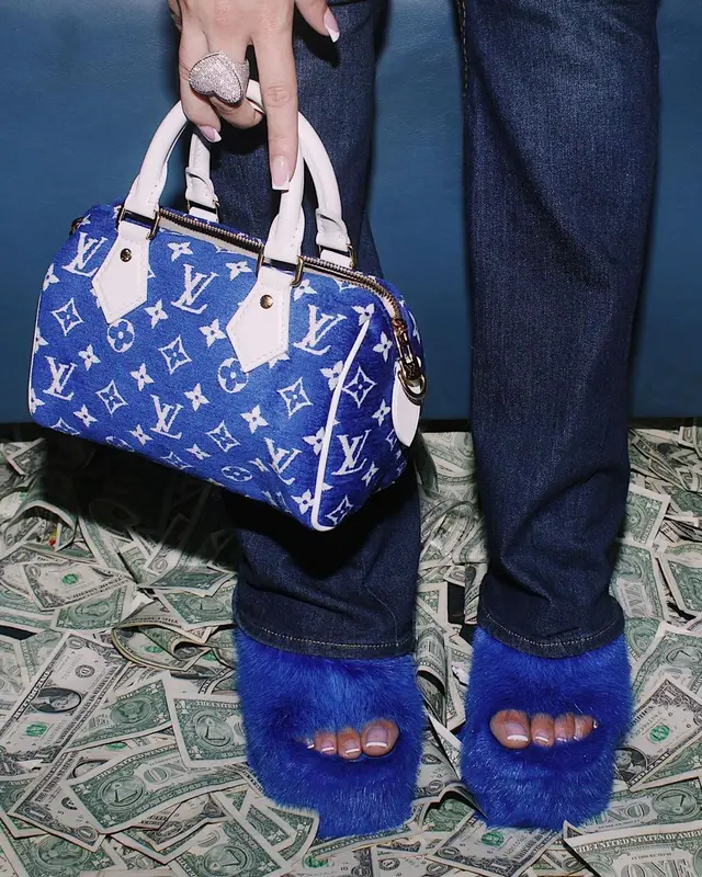 Latto outfit in True Religion, Louis Vuitton, and Chanel, 2022