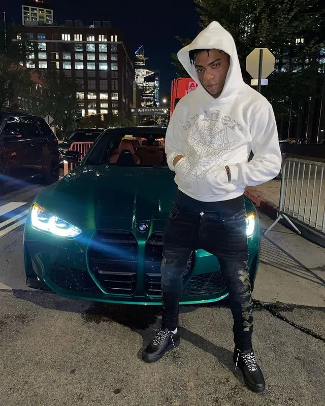 Dougie B outfit in Spider Worldwide, Amiri, and Supreme, 2022