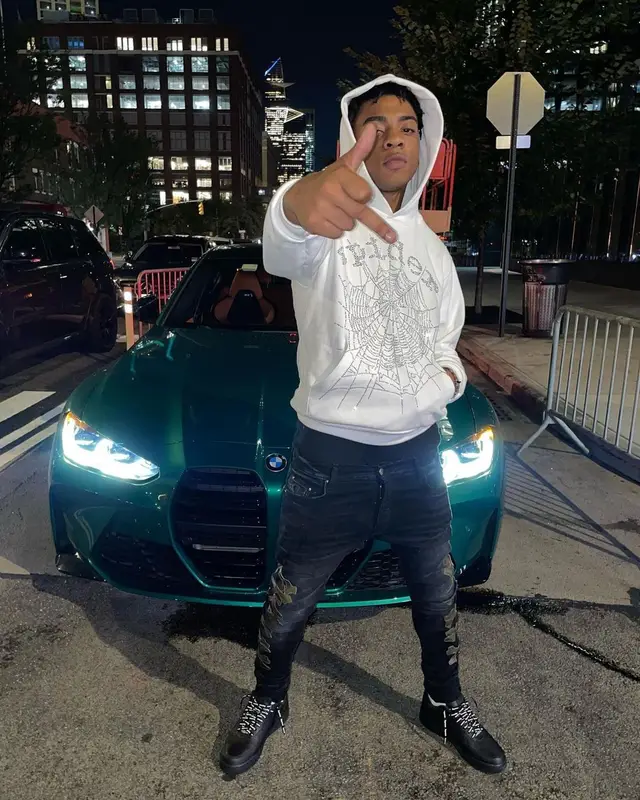 Dougie B outfit in Spider Worldwide, Amiri, and Supreme, 2022