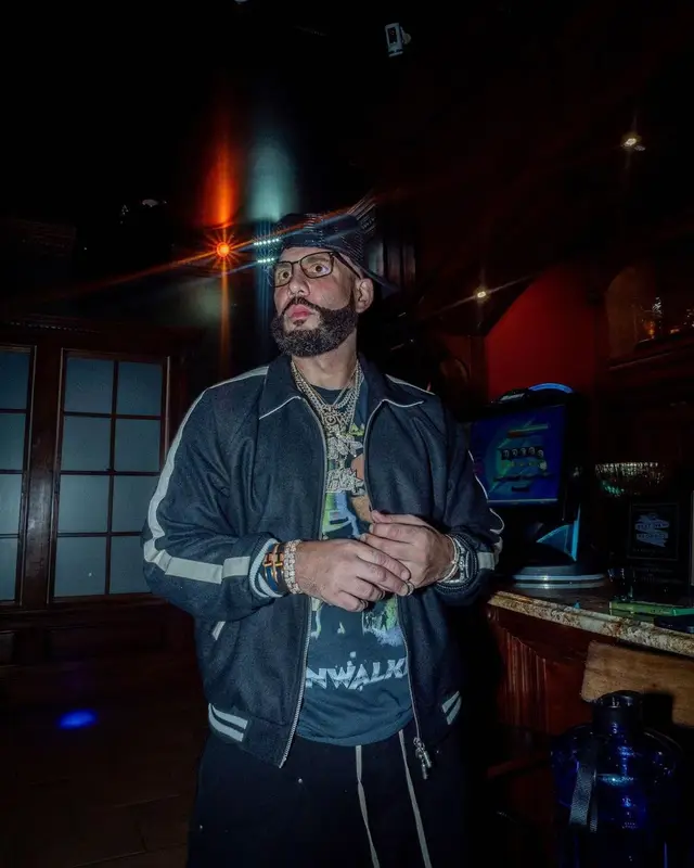 DJ Drama outfit in Rhude, Tom Ford, and Amiri, 2022