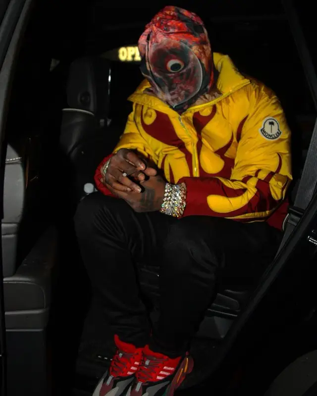 EST Gee outfit in Moncler, Versace, and Palm Angels, 2023