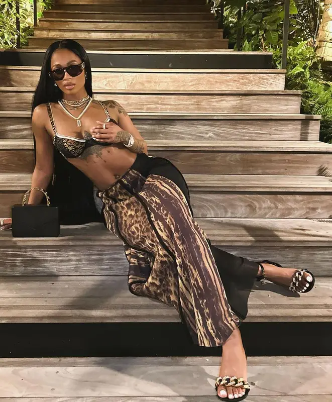 Dess Dior outfit in Amina Muaddi, Chanel, and Versace, 2023