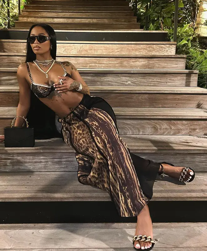 Dess Dior outfit in Amina Muaddi, Chanel, and Versace, 2023